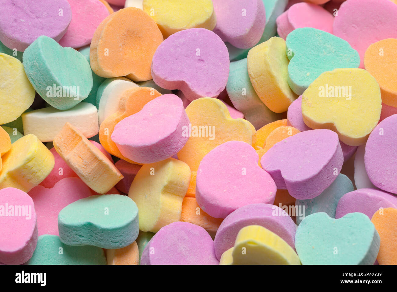 Pile of Pastle Valentines Hearts Candy Background. Stock Photo
