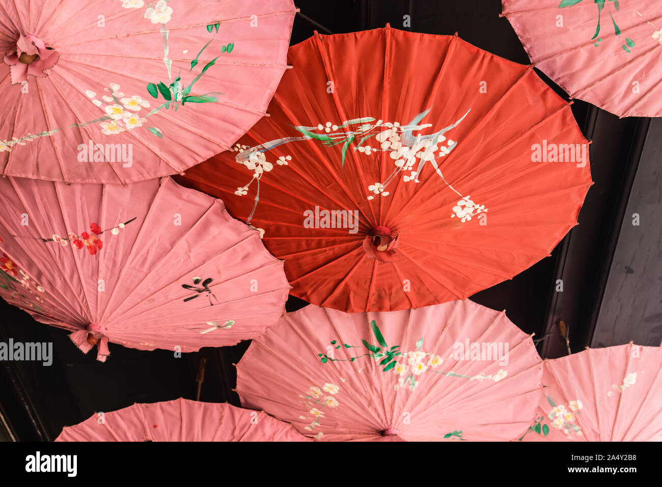 Chinese traditional umbrella display hanging on the roof Stock Photo