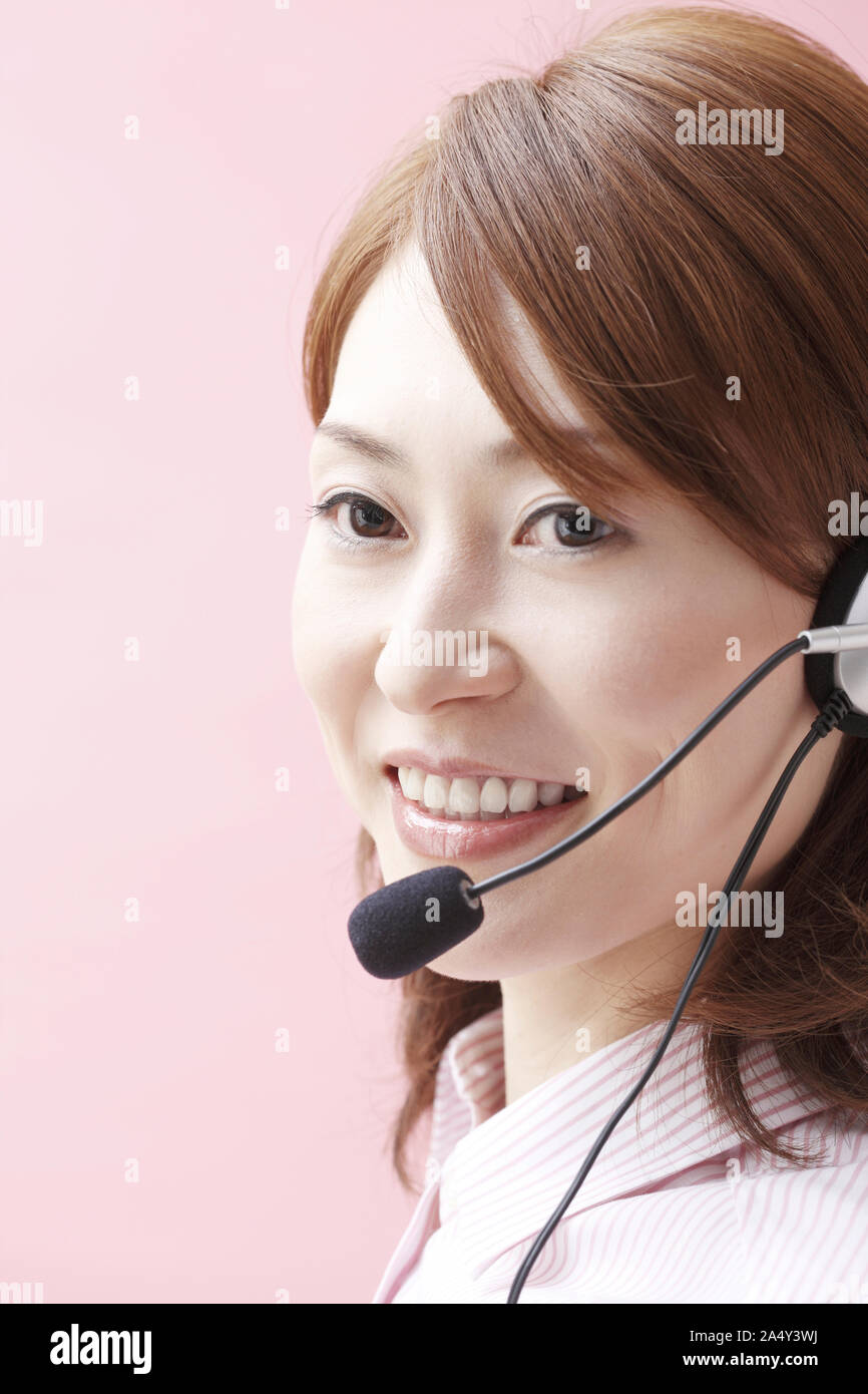 A telephone operator talking into a mic Stock Photo Alamy