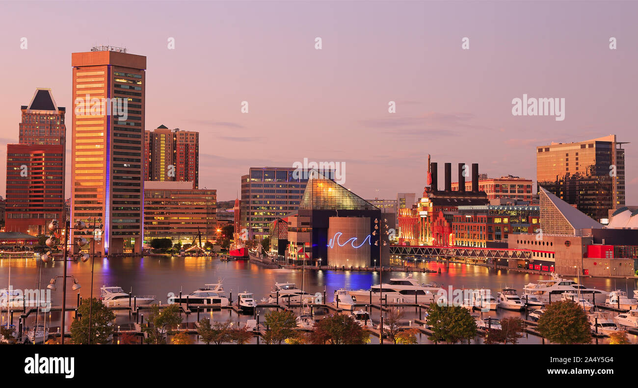 Colorful Baltimore skyline over the Inner Harbor at dusk Stock Photo