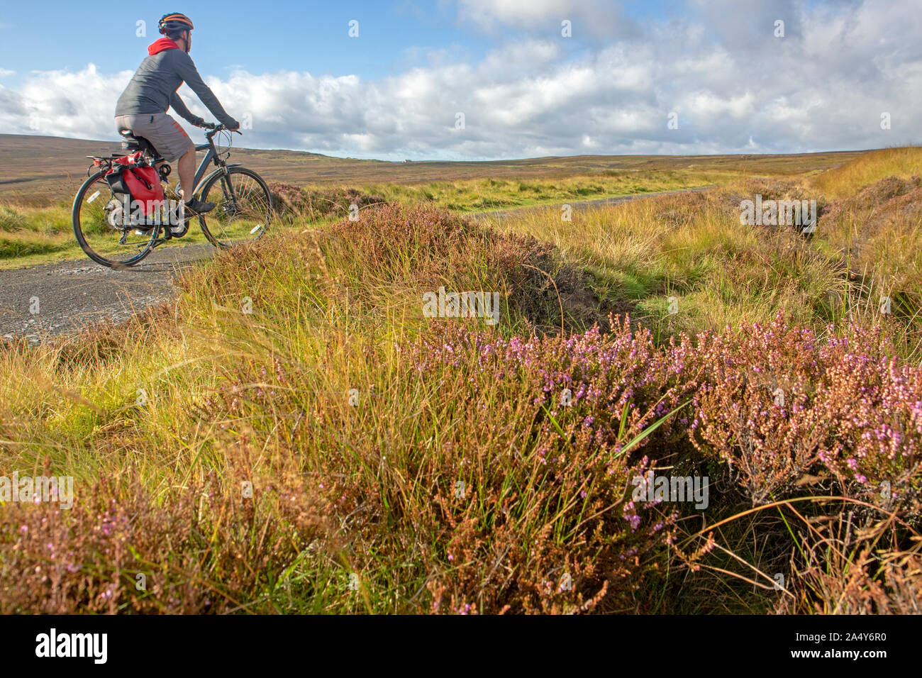 Cyclist on the Waskerley Way, part of the Coast to Coast route near Stanhope Stock Photo