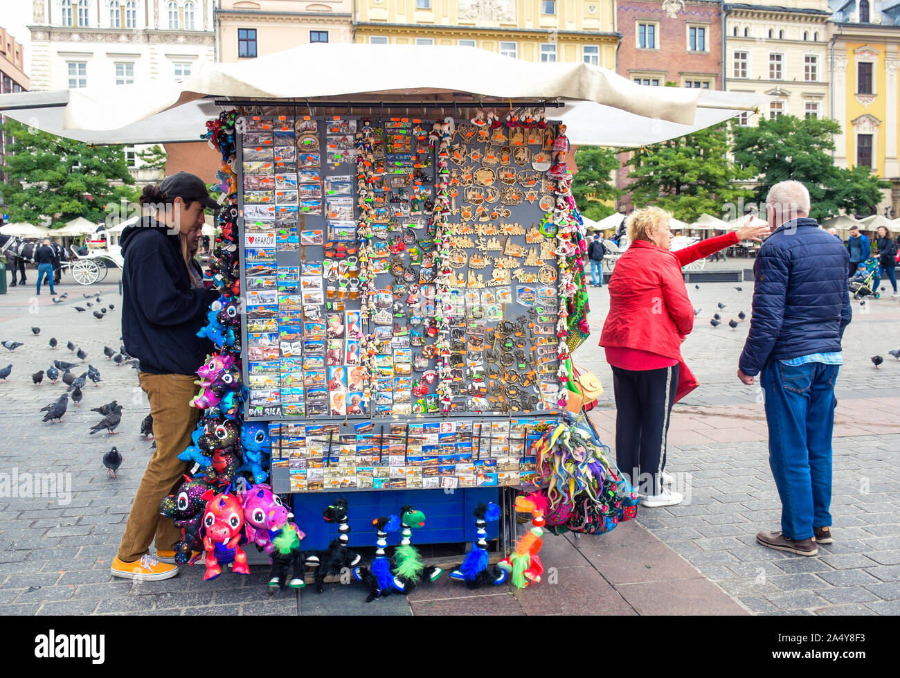 Souvenir shop kiosk selling souvenirs for tourists located at main market town square in Krakow old town, most famous tourist destination in Poland Stock Photo