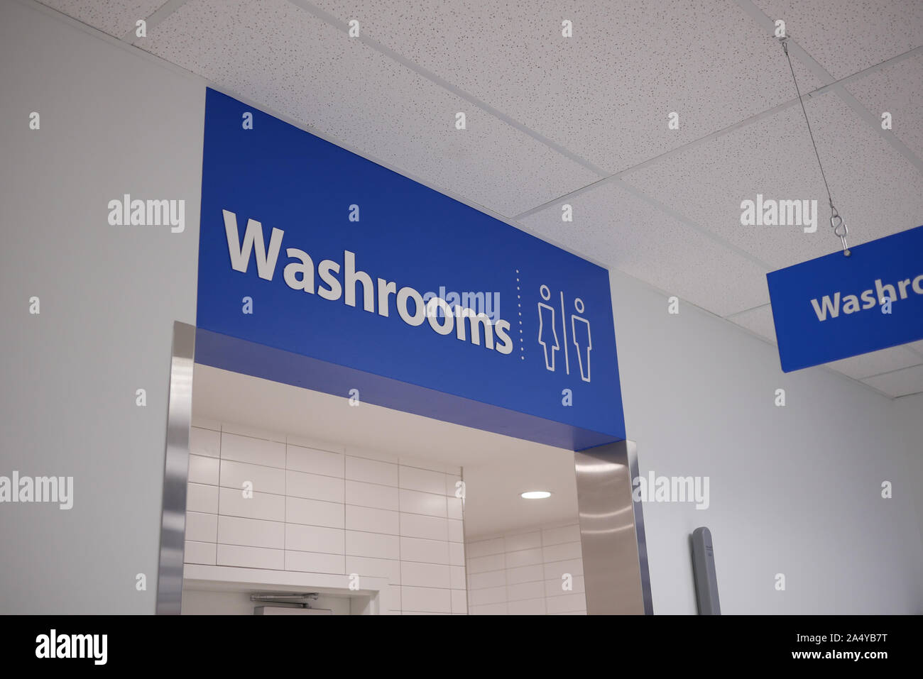 Motion of man and woman washroom logo on wall Stock Photo