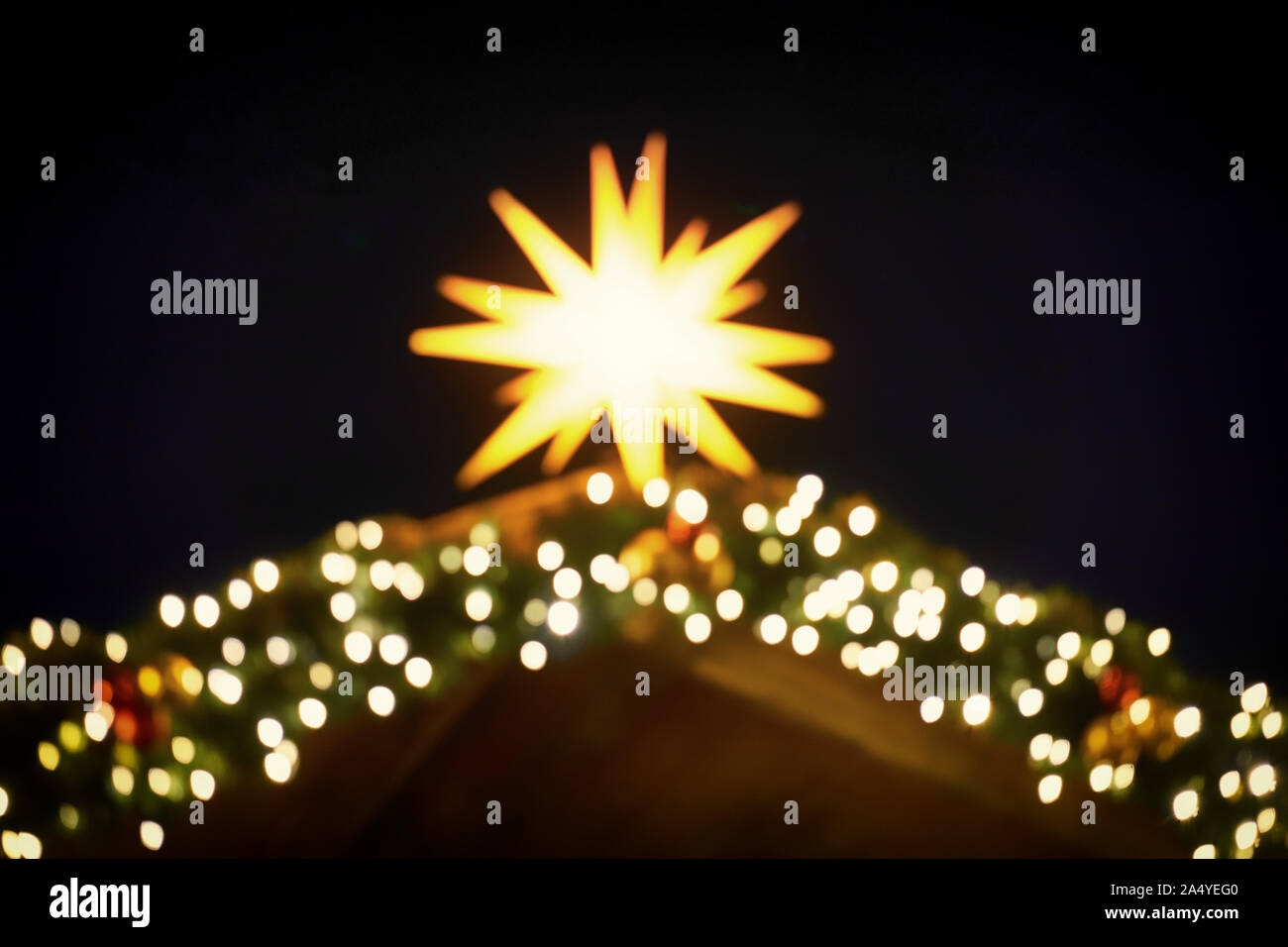Blurred round bright lens effects from a brilliant christmas star. As a Christmas decoration. Stock Photo