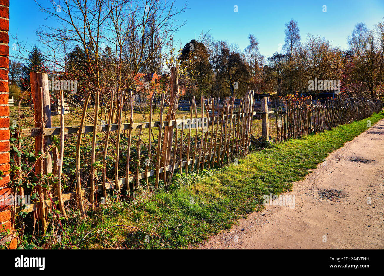 Old picket fence made of wood. Stock Photo