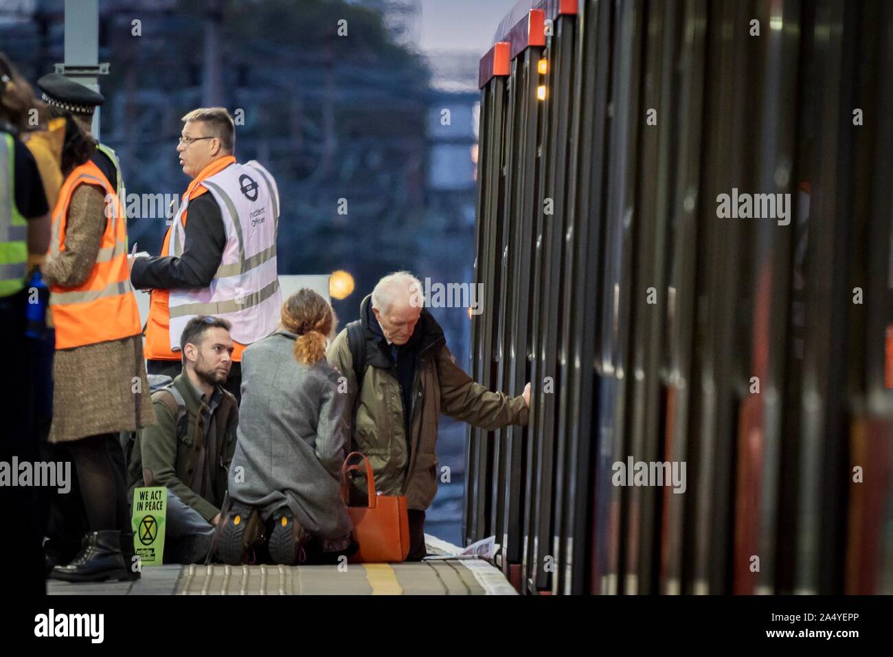London, UK. 17th Oct, 2019. Members of Christian Climate Action disrupt a DLR train at Shadwell station during the Extinction Rebellion protests in central London, UK. Credit: Vladimir Morozov/Alamy Live News Stock Photo