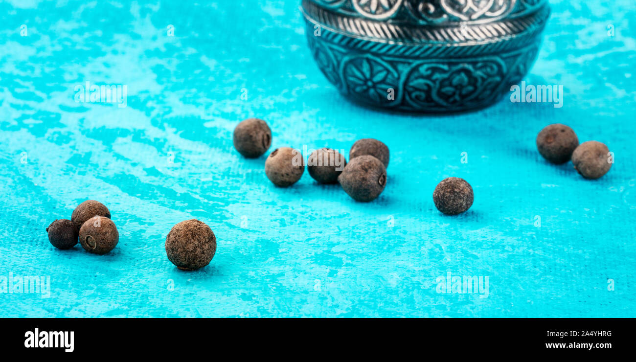 A panorama of allspice, Jamaican pepper. Black peppercorns with a