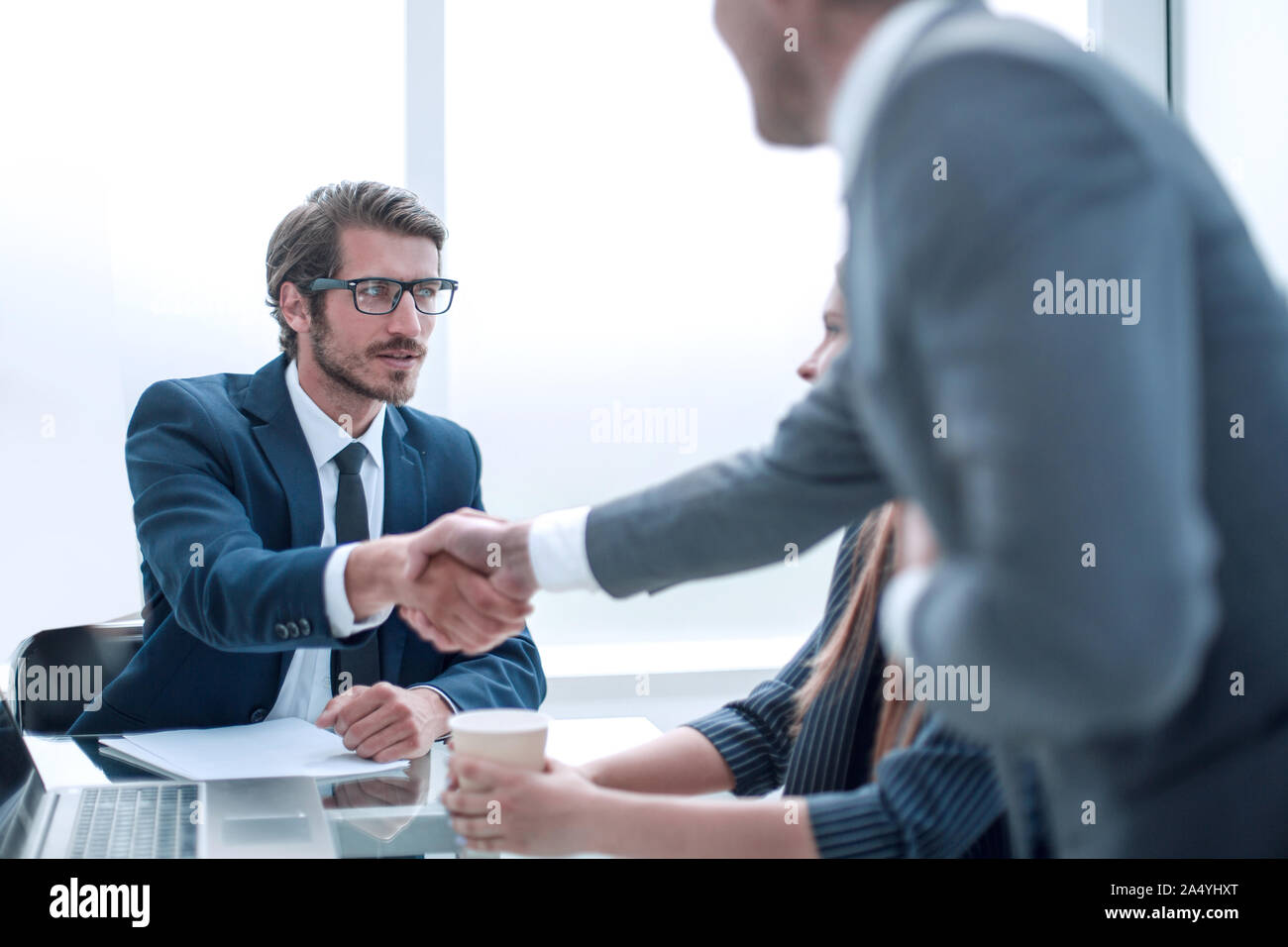 business colleagues shaking hands at a business meeting. Stock Photo