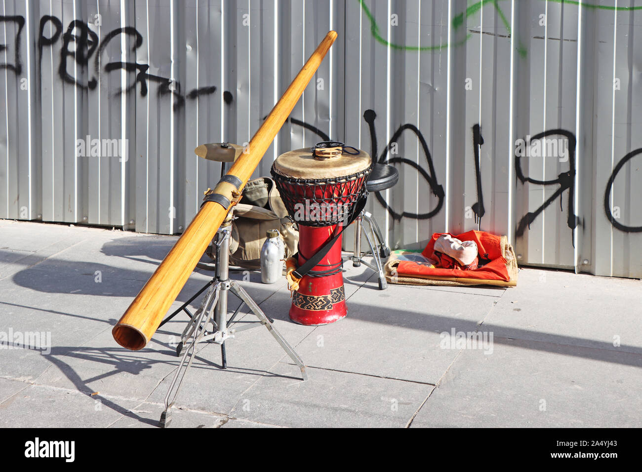 Didgeridoo and jembe drum on the city street Stock Photo