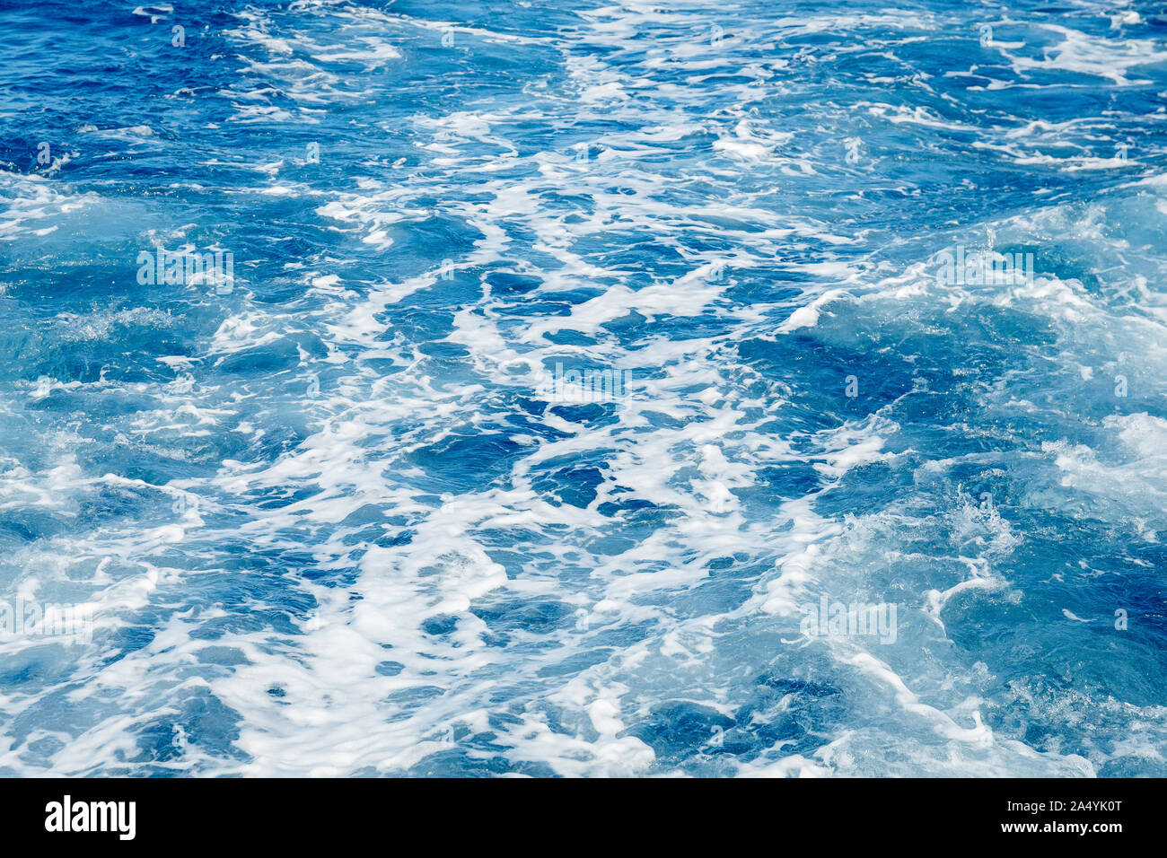 Blue sea surface background with splashing waves, top view Stock Photo ...