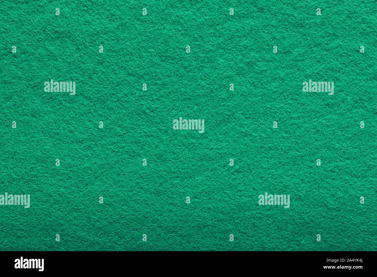 a shaggy surface. Fine grain felt green fabric. artificial grass