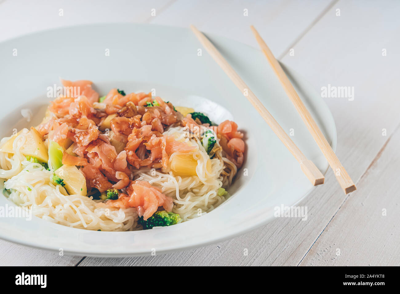 Noodles With Teriyaki Salmon, Broccoli And Pineapple Stock Photo