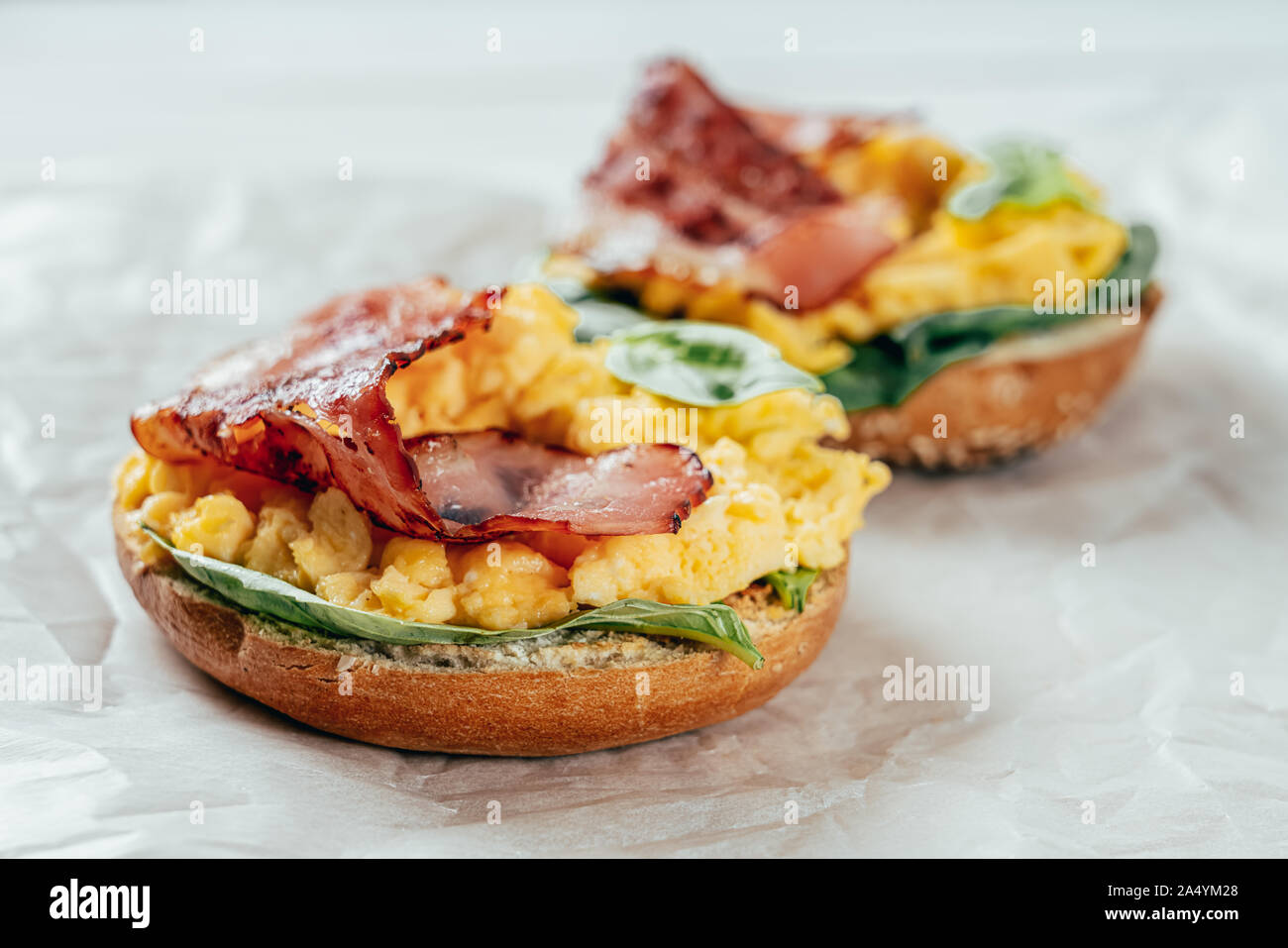 Breakfast Bagel With Scrambled Eggs Spinach And Bacon Stock Photo Alamy