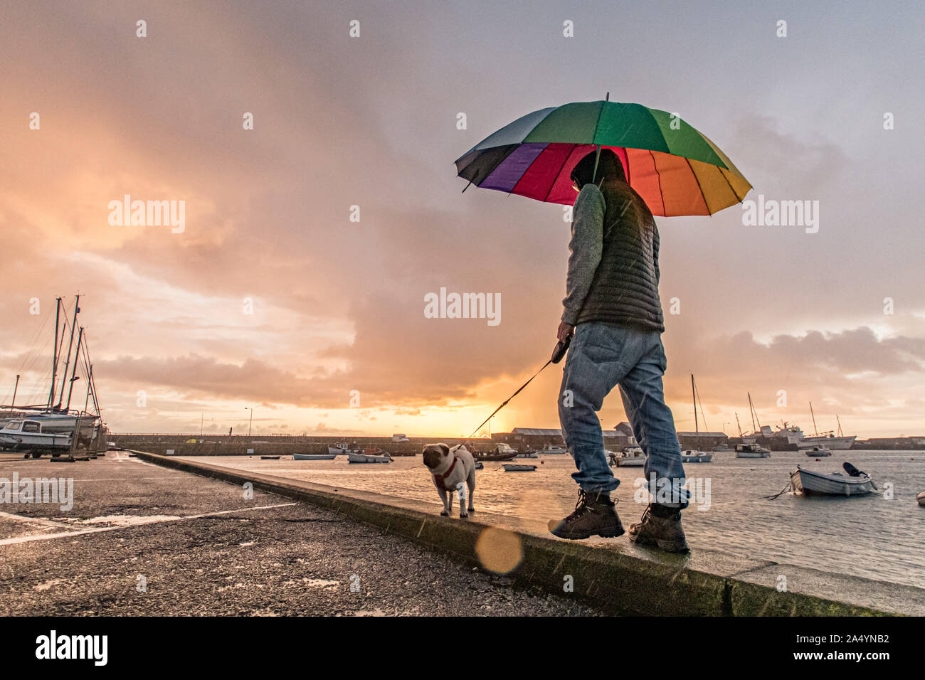 Penzance, Cornwall, UK. 17th October 2019. UK Weather. Changeable weather for sunrise this morning, with sharp showers and rainbows just after sunrise in Penzance. Credit Simon Maycock / Alamy Live News. Stock Photo