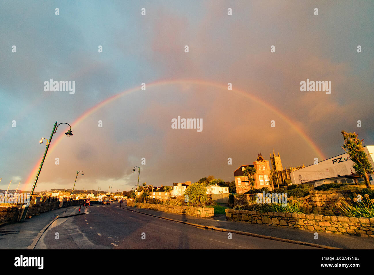 Penzance, Cornwall, UK. 17th October 2019. UK Weather. Changeable weather for sunrise this morning, with sharp showers and rainbows just after sunrise in Penzance. Credit Simon Maycock / Alamy Live News. Stock Photo