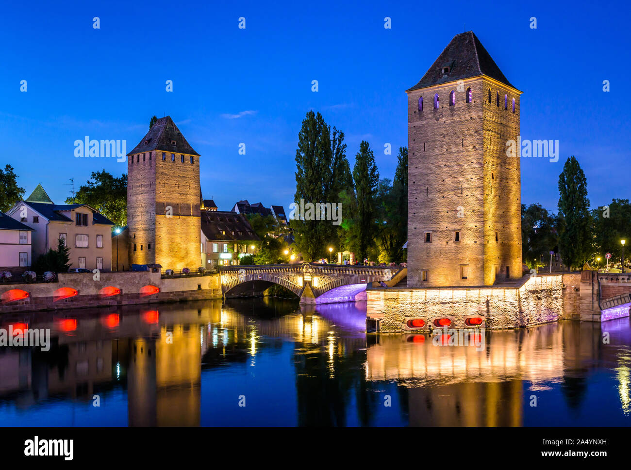 The Ponts Couverts at nightfall in Strasbourg, France, a medieval set of bridges and defensive towers in the Petite France historic quarter. Stock Photo