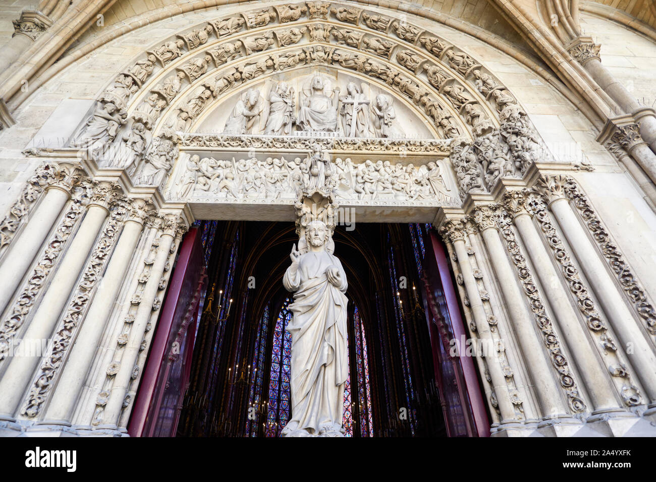 Exterior view and details of the entrance to the holy chapel (Sainte Chapelle) in Paris, France. Gothic royal medieval church located in the center of Stock Photo