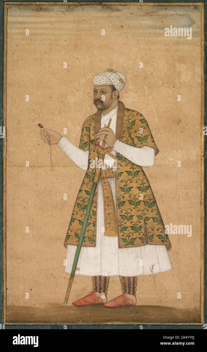 A Courtier, Possibly Khan Alam, Holding a Spinel and a Deccan Sword, c. 1605-1610. According to Akbar's court historian, the emperor ordered likenesses to be taken of the grandees of his realm. &quot;An immense album was thus formed: those that have passed away have received a new life, and those who are still alive have immortality promised them.&quot; Akbar's son and successor, Jahangir (reigned 1605-27), continued the tradition of commissioning works of lifelike portraiture for inclusion in imperial albums. This courtier wears an opulent fur-trimmed, fringed velvet coat over his belted whit Stock Photo