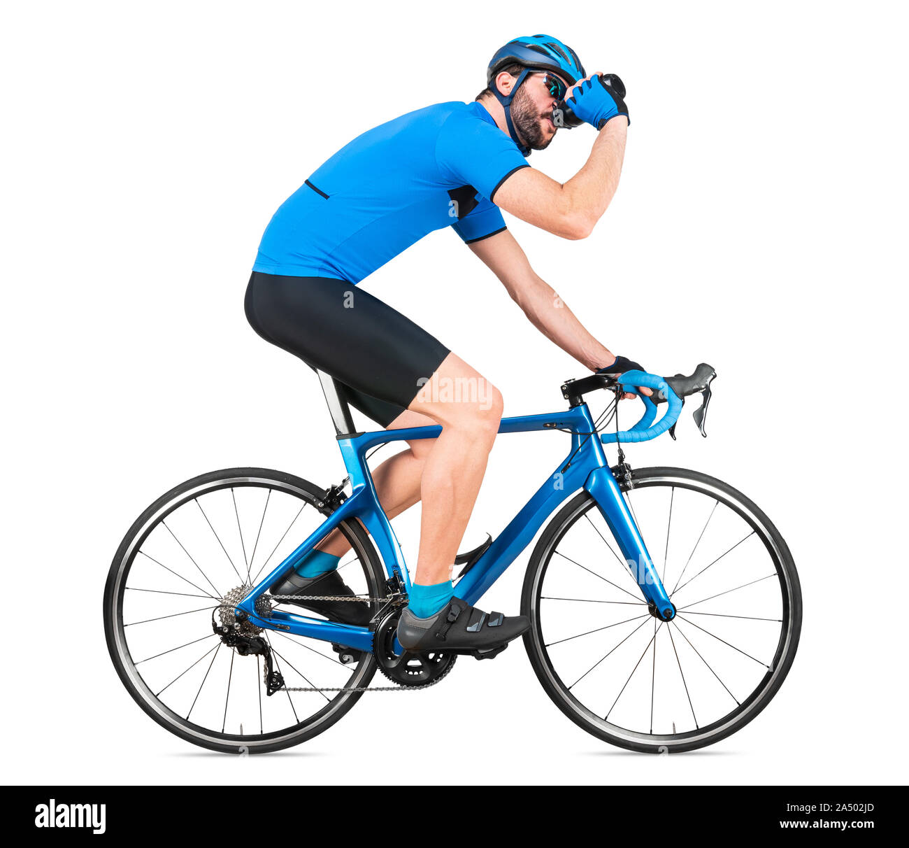 professional bicycle road racing cyclist racer  in blue sports jersey on light carbon race drinking out of water bottle. sport training cycling concep Stock Photo
