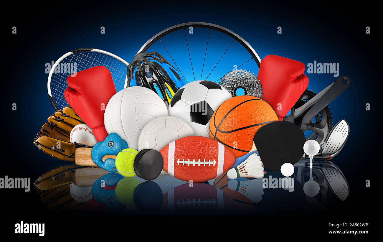 huge collection stack of sport goods and balls gear bicycle wheel equipment from various team and individual sports on dark blue black background Stock Photo