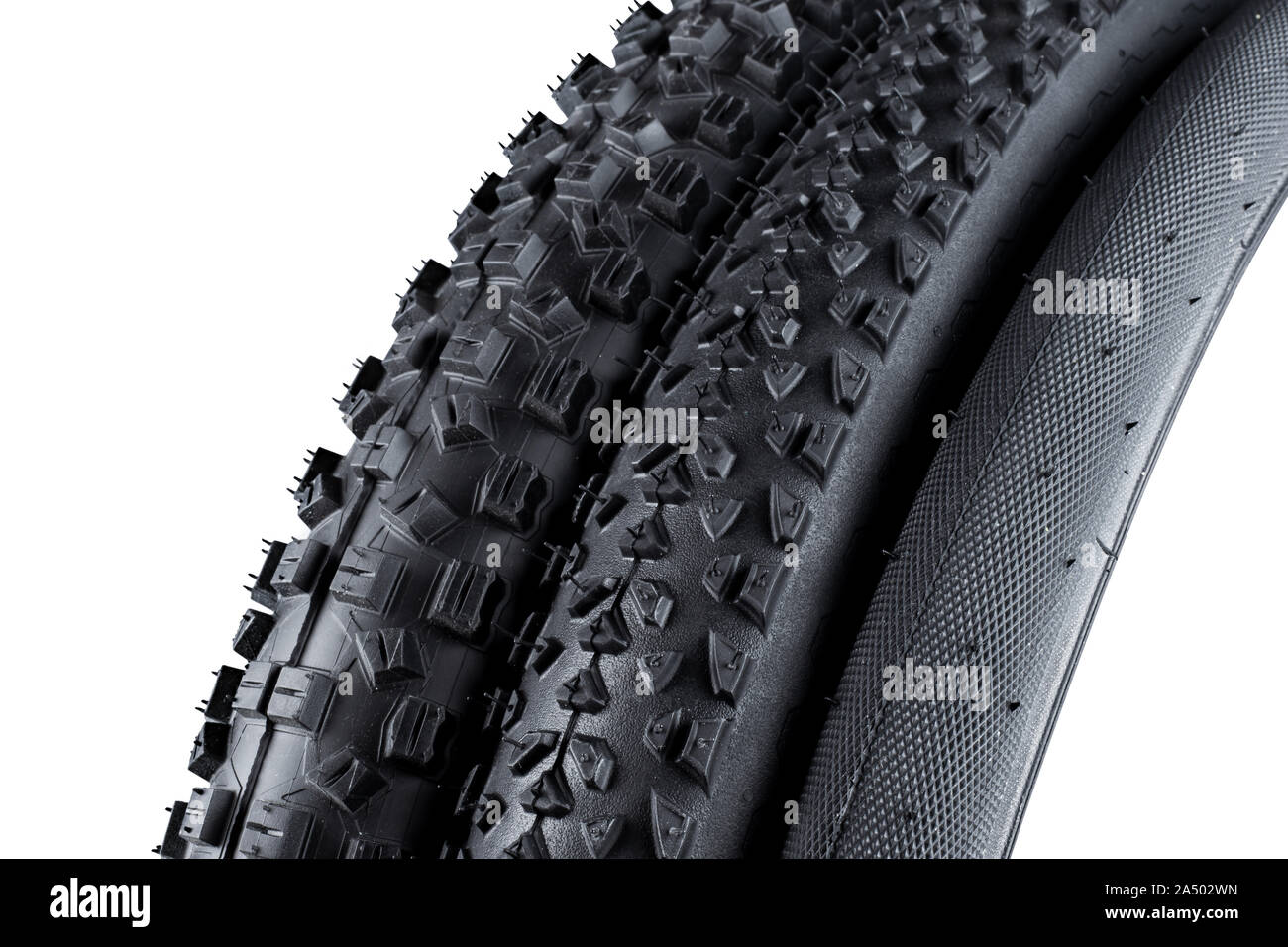 various black rubber bicycle tyres with different type of tread profile isolated on white background Stock Photo