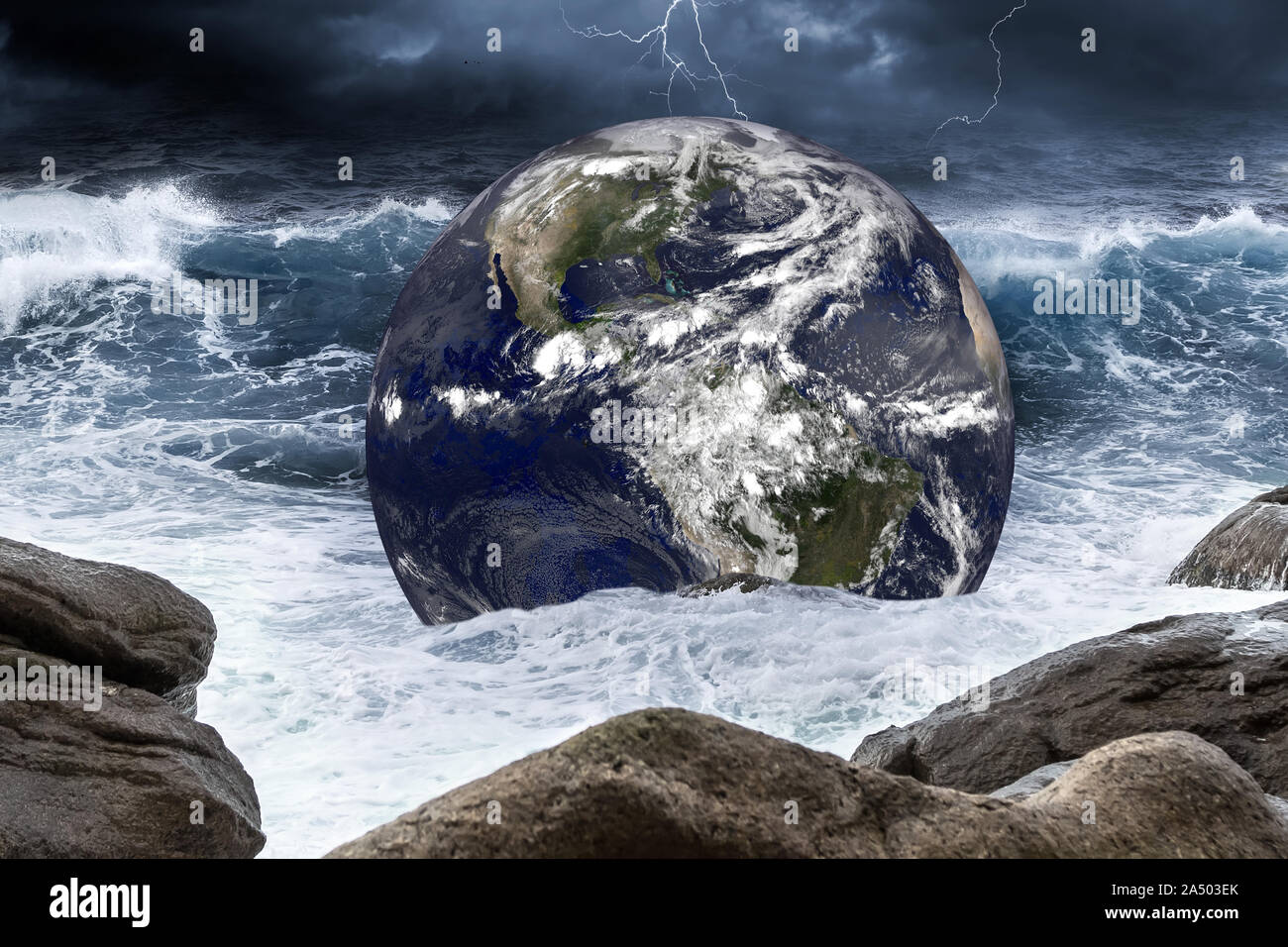 planet earth globe in thunderstorm wave of water in the rough ocean. Climate change global warming concept on sea background. Elements of this image f Stock Photo