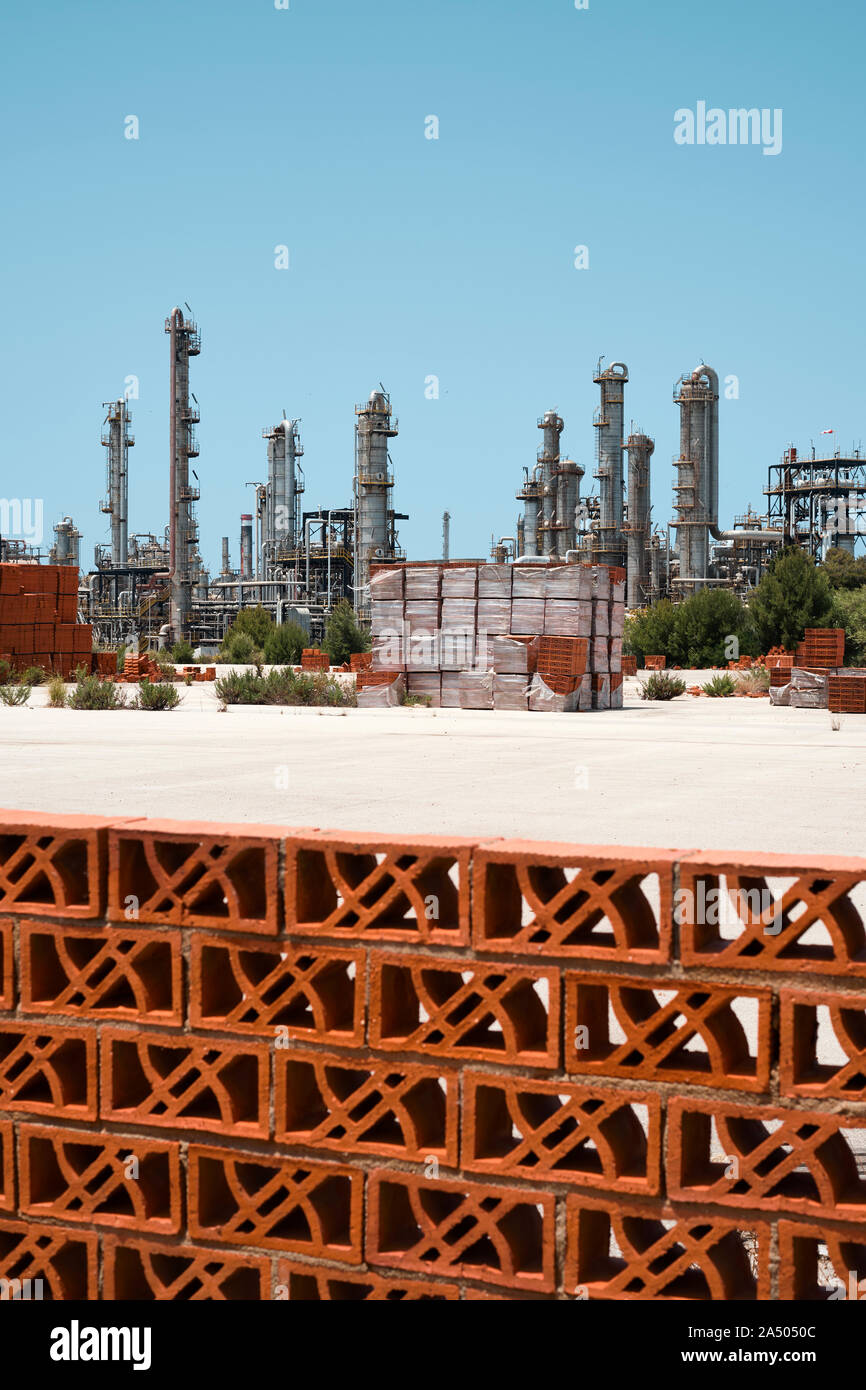 The flat Industrial landscape of Porto Torres in Sardinia Italy Europe. Stock Photo