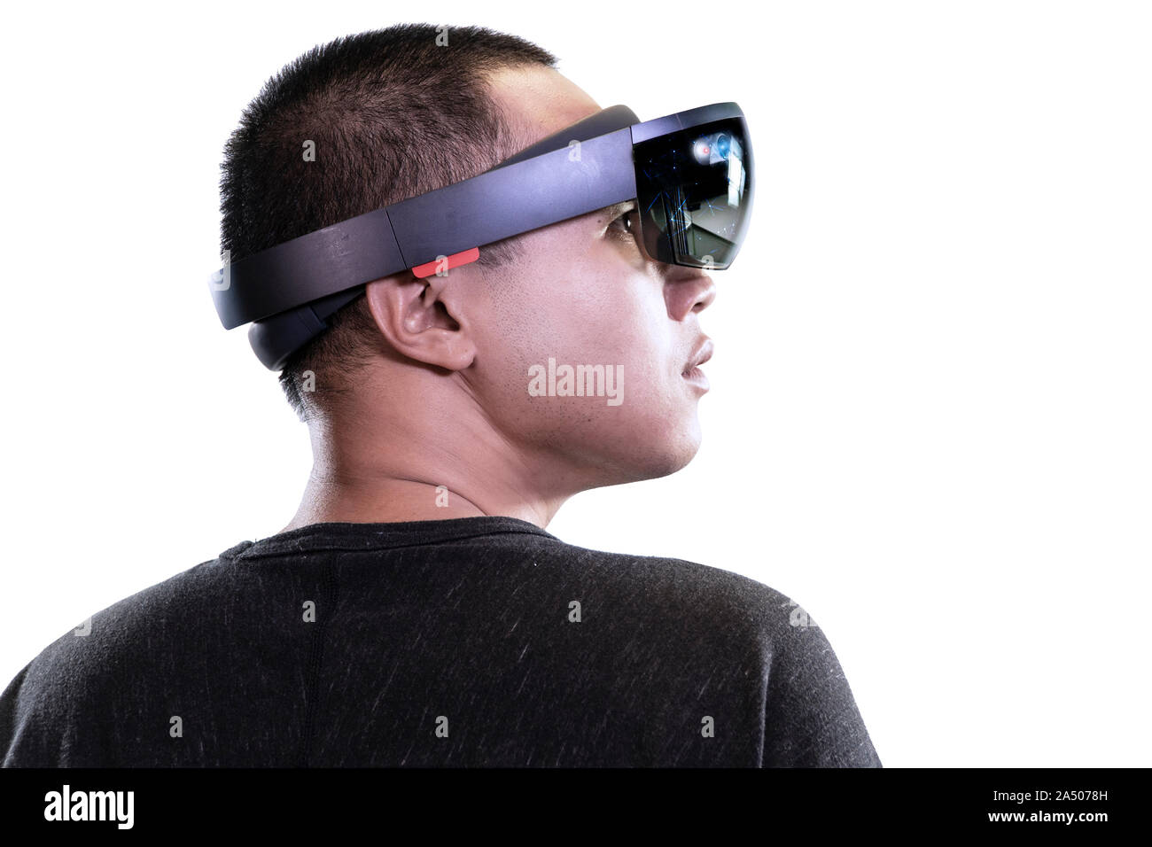 Portrait of man try Mixed reality with HoloLens glasses isolated on white background. Future Technology concept Stock Photo