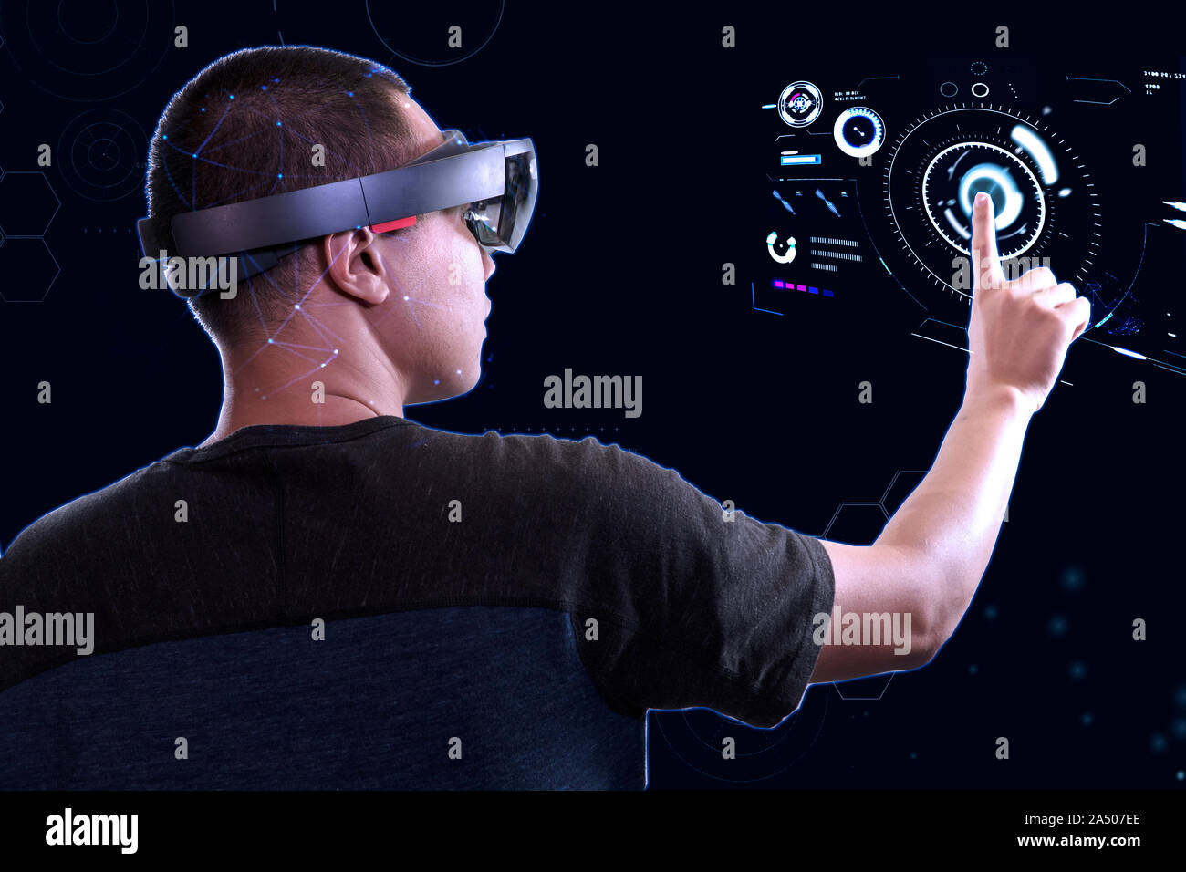 Young men trying Mixed reality glasses with interactive panel in the virtual world. Future Advanced Technology concept Stock Photo