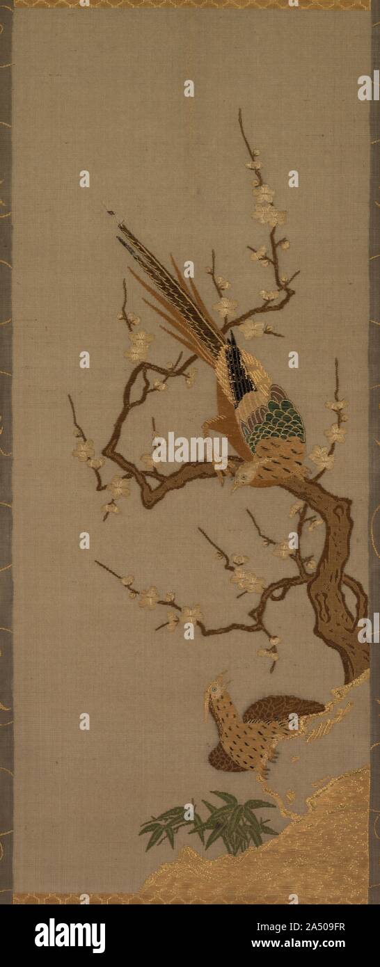 Birds in a Tree, 18th-19th century. This scene of two Chinese pheasants with a flowering plum tree (a sign of the arrival of spring in Japan) is not painted. All the lines and surfaces are created by coloured threads carefully stitched together into the silk. Consequently, the surface appears quite different from the paintings on paper shown nearby. Stock Photo