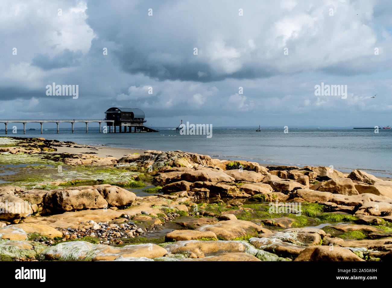 The Bembridge Lifeboat Station is an RNLI station on the Isle of Wight. Shown at low tide revealing the colourful foreshore at low tide. Stock Photo