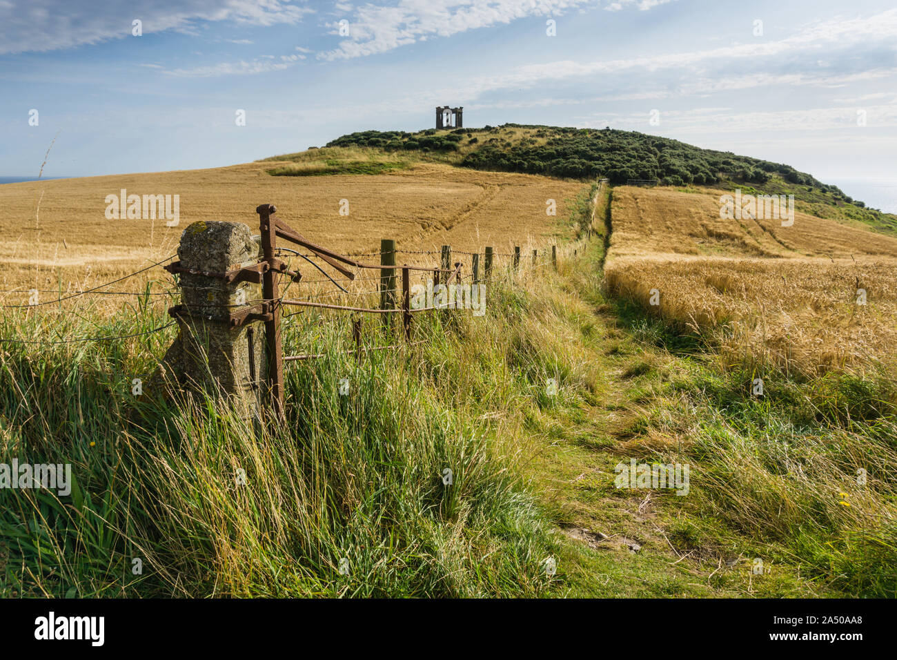 Path along the fields towards Stonehaven War Memorial on the Black Hill near Dunnottar Castle, Aberdeenshire Stock Photo