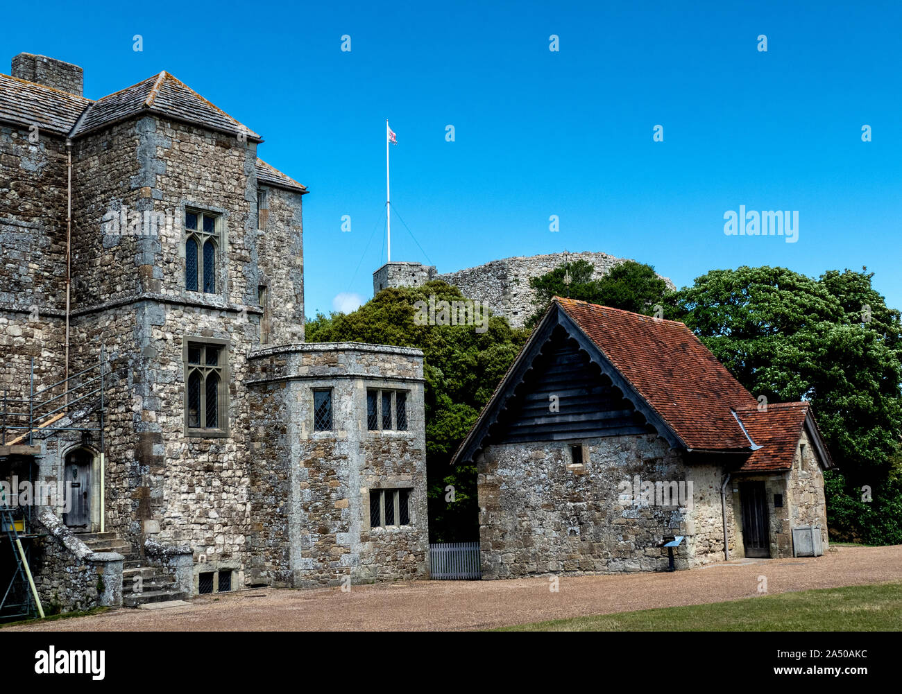 The courtyard of Carisbrooke Castle showing the wheelhouse building for the working donkeys Stock Photo