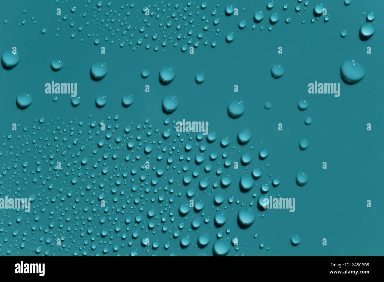 Macro image of water drops on green surface Stock Photo - Alamy
