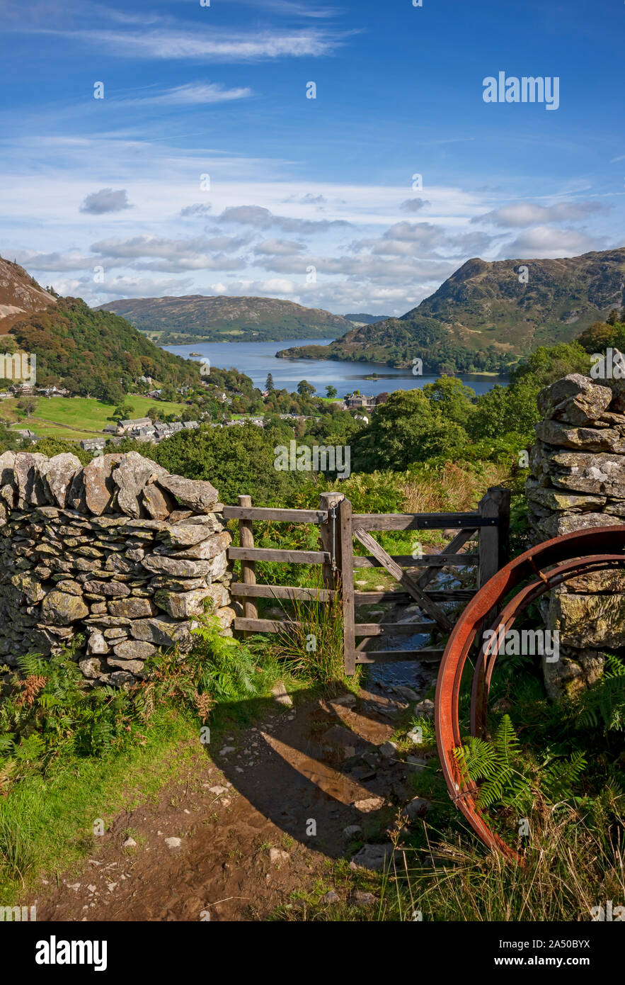 Looking towards Ullswater from Birkhouse Moor path drystone wall gate summer Glenridding Lake District National Park Cumbria England UK Great Britain Stock Photo