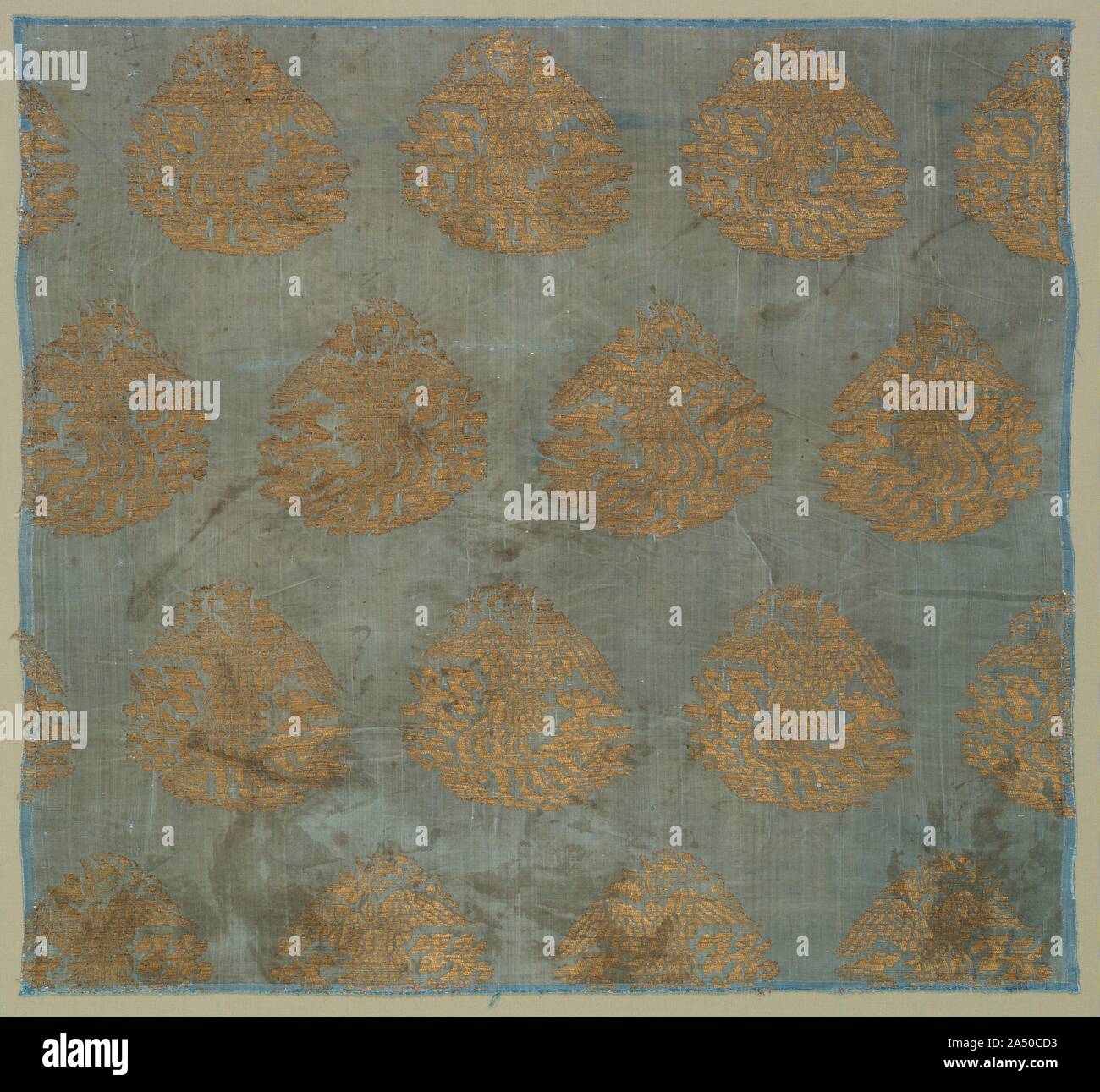 Brocade with Soaring Phoenixes among Clouds , 1100s-1200s. Brocade with Soaring Phoenixes among Clouds Tabby, brocaded; silk and gold thread Jin Dynasty (1115-1234) The Cleveland Museum of Art, John L. Severance Fund 1994.292 (Cat. no. 31) The gold-brocaded designs of Jin brocades, such as this example with graceful phoenixes soaring into clouds, are typically asymmetrical. Moreover, they have no frame or border, and appear to have been cut out of larger decorative images. Stock Photo