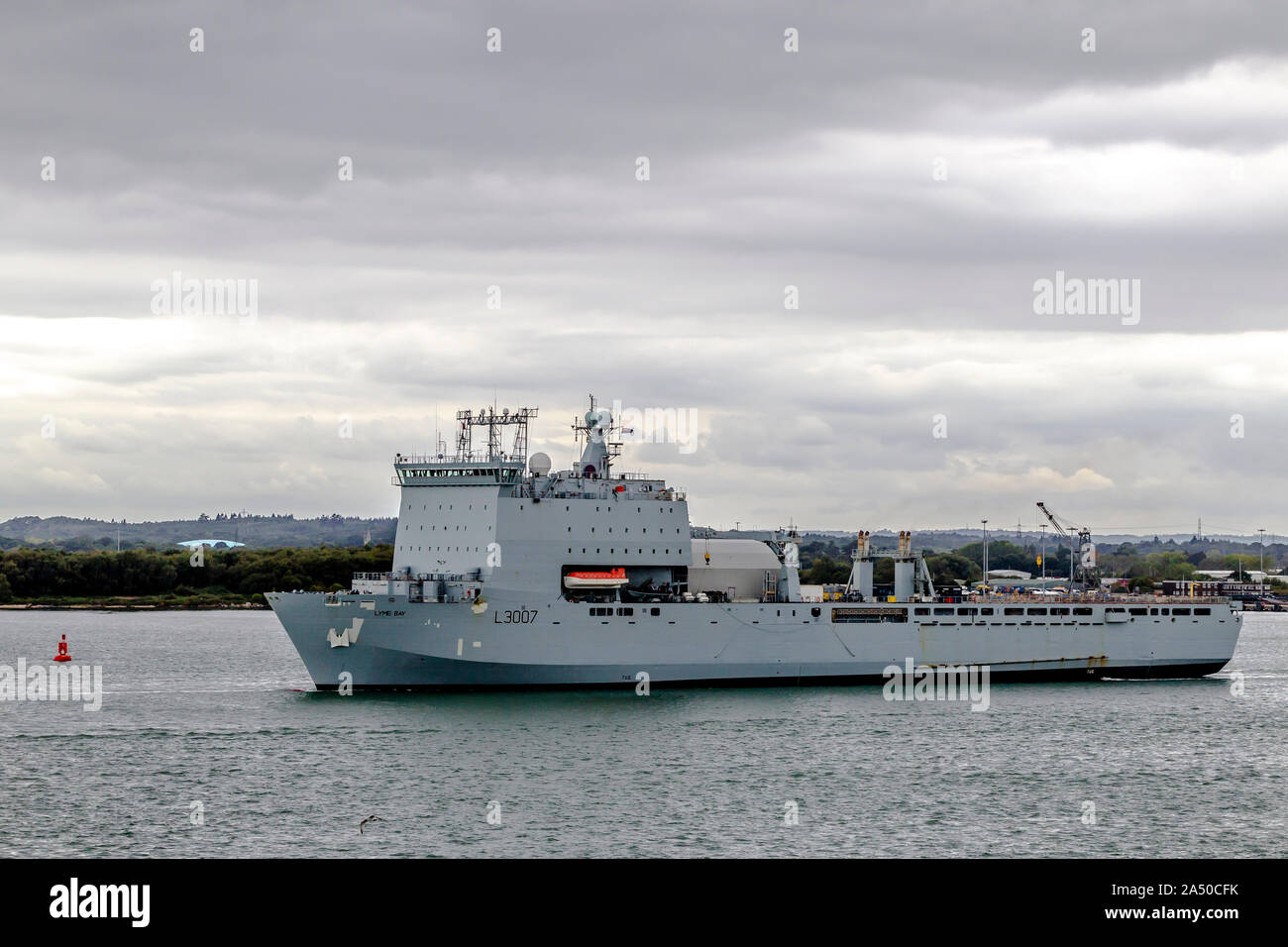 Royal Fleet Auxiliary ship RAF Lyme Bay sailing out of the docks at