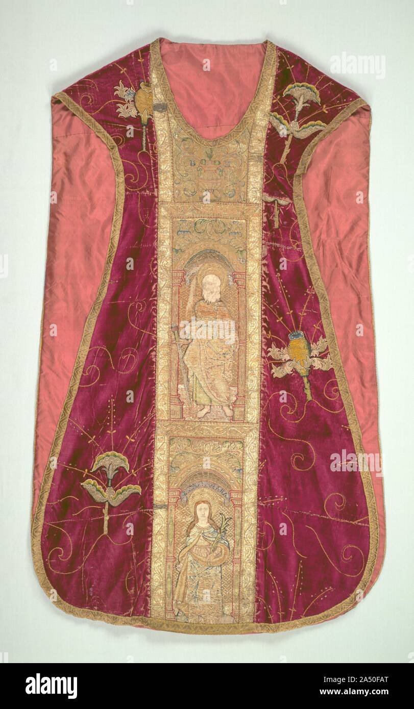 Chasuble, 1500-1520. After centuries of elaborate work, the English adopted a simpler style of embroidering vestments suitable for mass production around 1500. Isolated motifs, often floral, were embroidered on a plain linen cloth, cut out, and appliqu&#xe9;d on velvet; their edges were then concealed with couching stitches, as in this ecclesiastical chasuble. The orphrey band in the center depicts Saints Peter, John the Evangelist, and Andrew, identified by their names and attributes (top to bottom). Most of the surface is covered with gold thread sewn down by coloured silk thread passing ove Stock Photo