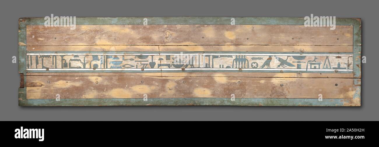 Coffin of Senbi (Lid), 1918-1859 BC. This is the most common type of coffin during the Middle Kingdom. The mummy was placed on his left side, facing east, his head behind the two magical eyes. These--in the shape of human eyes, to which have been added the markings of a falcon's head--were supposed to enable him to behold the rising sun, reborn daily. The long horizontal inscriptions are prayers to Anubis (god of embalming) and Osiris (god of the dead) for offerings of food and drink and other items necessary in the afterlife. The short vertical inscriptions place him under the protection of v Stock Photo