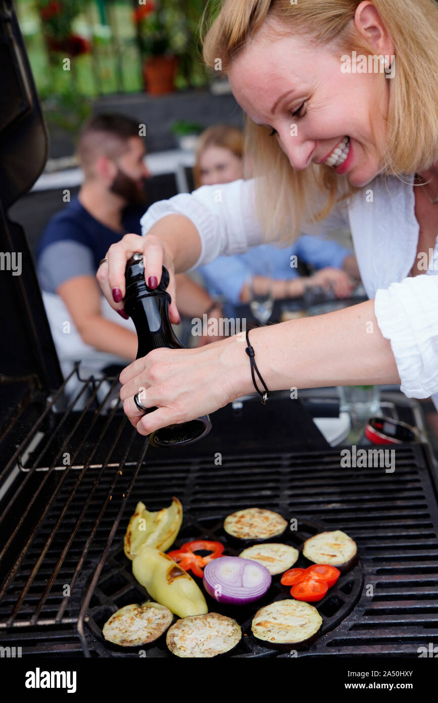 Woman at the Barbecue, Karlovy Vary, Czech Republic Stock Photo