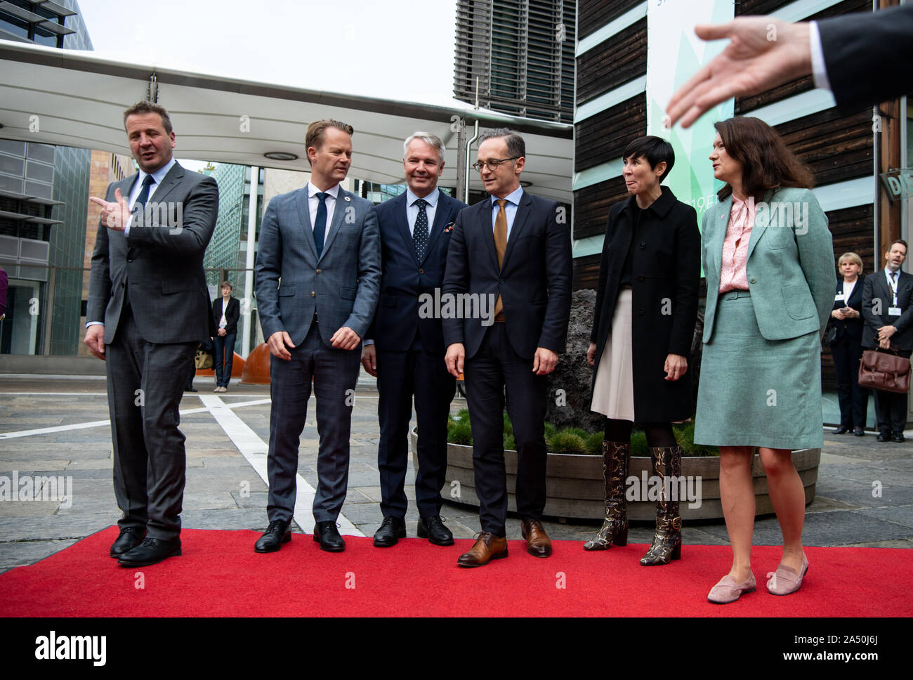 17 October 2019, Berlin: Heiko Maas (4th from left, SPD), Foreign Minister, is welcomed by the Foreign Ministers of the Nordic countries (l-r), Gudlaugur Thor Thordarson (Iceland), Jeppe Kofod (Denmark), Pekka Haavisto (Finland), Ine Marie Eriksen Søreide (Norway) and Ann Linde (Sweden) at the anniversary celebrations of 20 years of Nordic Embassies in Berlin. On 20.10.1999 the common embassy complex of the five Nordic countries was inaugurated in Berlin-Tiergarten. Photo: Bernd von Jutrczenka/dpa Stock Photo