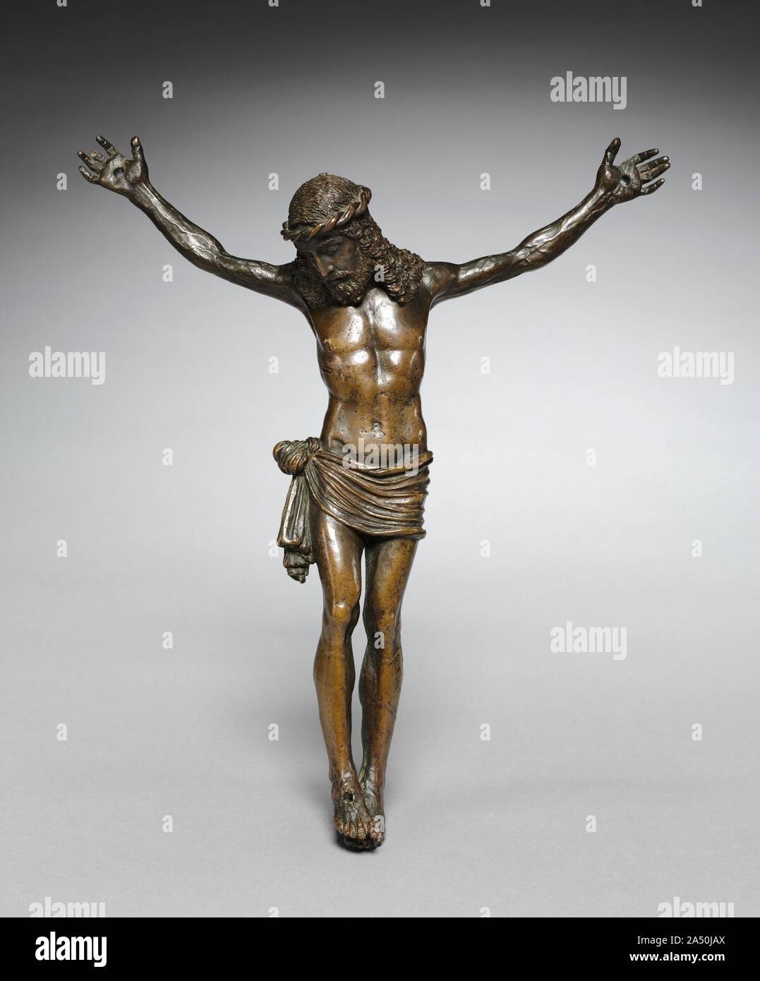 Crucified Christ, c. 1500. The highly finished surface of this sculpture, including the back, suggests it belonged to a refined collector. Small sculptures would often be held to admire details such as the strands of hair streaming onto Christ&#x2019;s shoulders, the prominent veins in his forearms, and the intricate knotted cloth at his side. Stock Photo