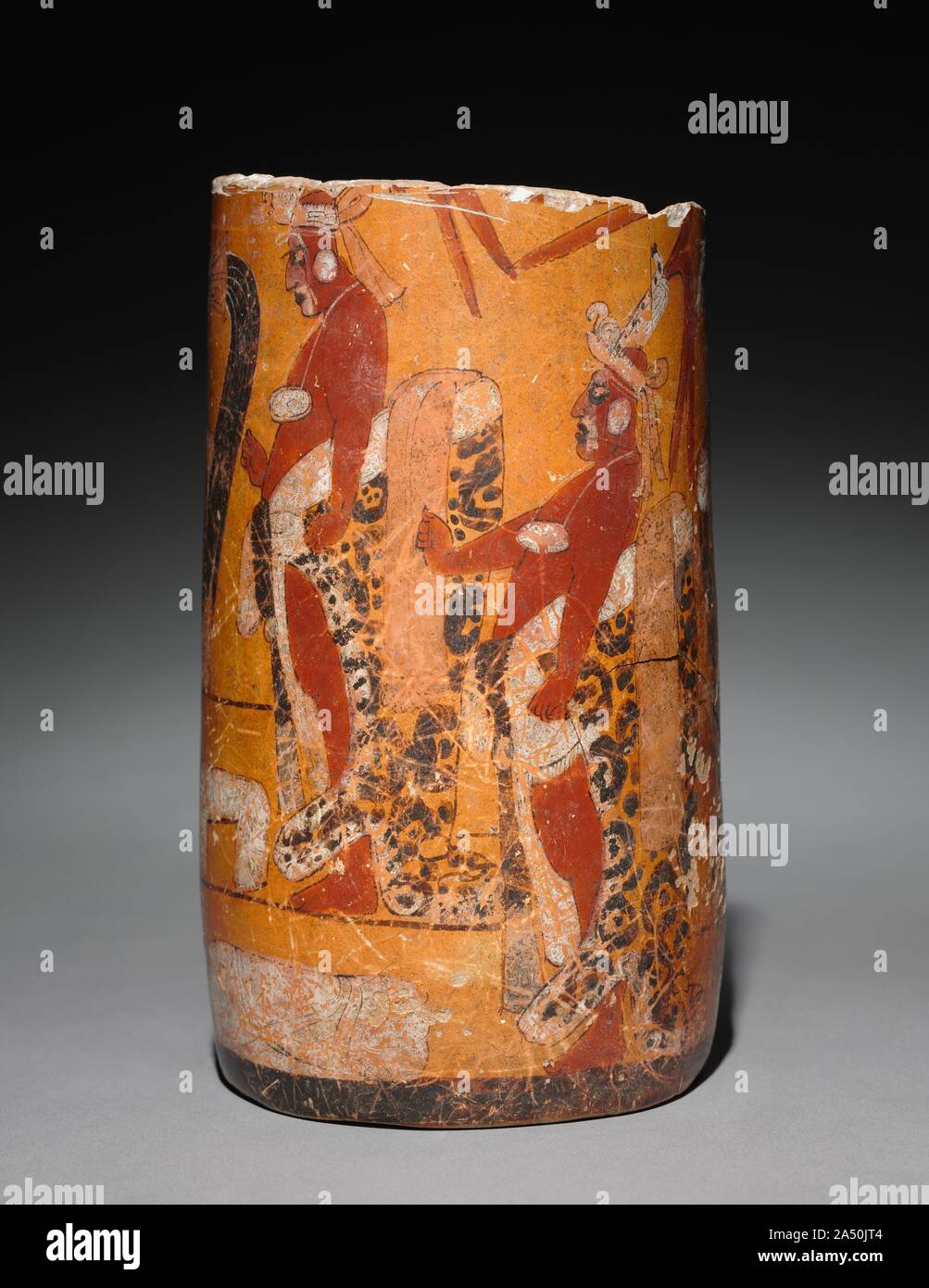 Cylindrical Vessel with Palace Scene, 600-900. The scene here may commemorate a special event in the life of a Maya ruler, who stands on a stairway before his throne, his legs framed by a litter on the ground. His gesture and the jaguar pelt at the waist visually unify him with his attendants. The ruler perhaps used the vessel as a drinking cup on important occasions; fine ceramics also served as gifts and as offerings in tombs. Stock Photo