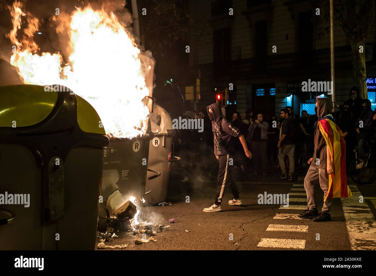 Protesters set a barricade on fire during the demonstration.Hundreds of protesters concentrated on the Gran Vía Street in Barcelona during the third day of protest following the sentences of the Spanish Supreme Court that condemns Catalan political prisoners to long prison terms. The demonstration culminated in front of the headquarters of the Department of Interior of the Generalitat with heavy police charges and barricades set on fire. Stock Photo