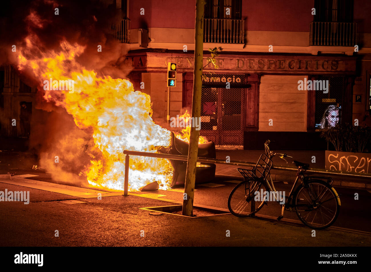 A barricade on fire during the demonstration.Hundreds of protesters concentrated on the Gran Vía Street in Barcelona during the third day of protest following the sentences of the Spanish Supreme Court that condemns Catalan political prisoners to long prison terms. The demonstration culminated in front of the headquarters of the Department of Interior of the Generalitat with heavy police charges and barricades set on fire. Stock Photo