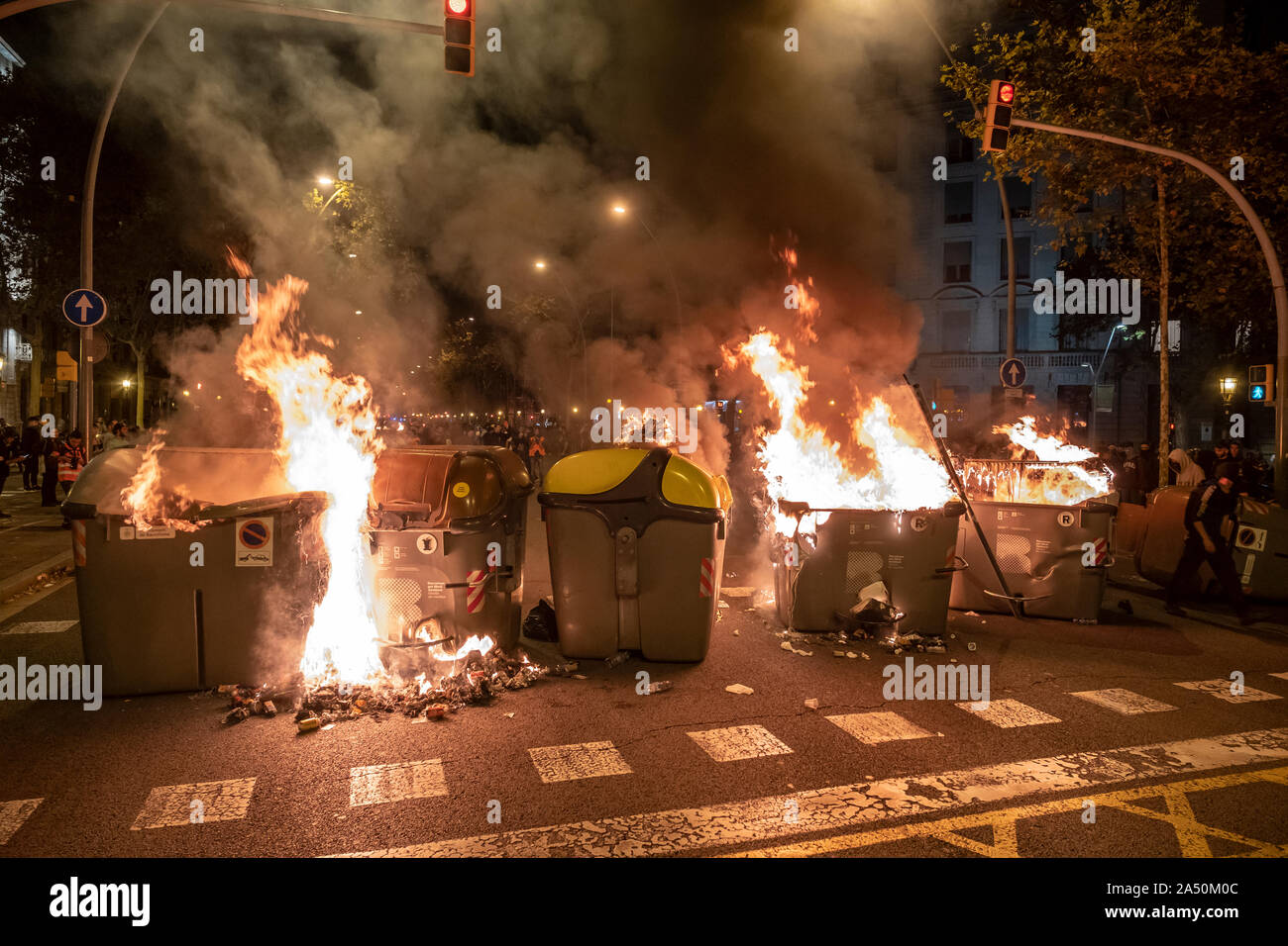 Burning barricades in the middle of the road during the demonstration.Hundreds of protesters concentrated on the Gran Vía Street in Barcelona during the third day of protest following the sentences of the Spanish Supreme Court that condemns Catalan political prisoners to long prison terms. The demonstration culminated in front of the headquarters of the Department of Interior of the Generalitat with heavy police charges and barricades set on fire. Stock Photo