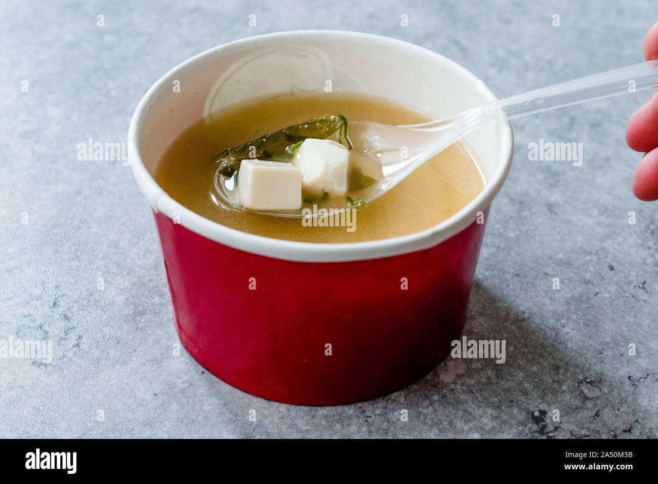 Takeout Container Of Chinese Wonton Soup With Chopsticks On A