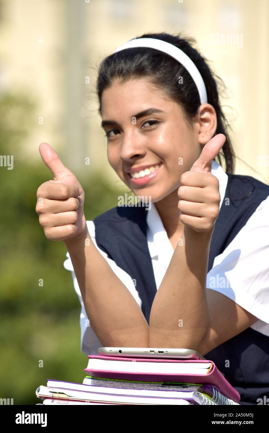 School Girl With Thumbs Up With Notebooks Stock Photo - Alamy