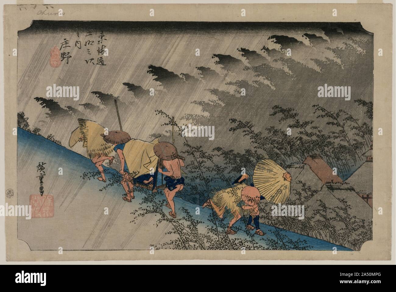 Driving Rain at Shono (Station 46) from the series Fifty-Three Stations of the Tokaido, 1833. In this print, Hiroshige mastered capturing the atmospheric qualities of rain and its effects on travelers wearing straw raincoats. The publisher&#x2019;s name, Takenouchi, is written on the umbrella. His large red seal is stamped on the left side of the print.   Hiroshige often depicted rainfall with distinct slanted lines. Here, he also added sheets of gray shading to emphasize the intensity of the downpour. In addition, three different shades of gray, requiring three different stages of the printin Stock Photo