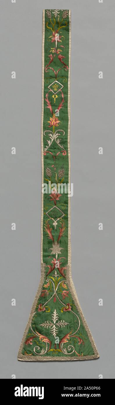 Embroidered Stola, 1700s. Sheaves of wheat and bunches of grapes, symbols of bread and wine in the Mass, are embroidered with silver-metal thread amid scrolling leaves on the green silk-damask ground. Liturgical colours&#x2014;white, red, green, and black, purple, or blue&#x2014;mandated by Pope Innocent III in the late 1100s were widely ignored by the 1700s, replaced primarily by a lavish use of gold, silver, and pastel silk thread embroidered on white silk fabrics. Long matching stoles were worn under the chasuble in styles that identified deacons, priests, and bishops. Stock Photo